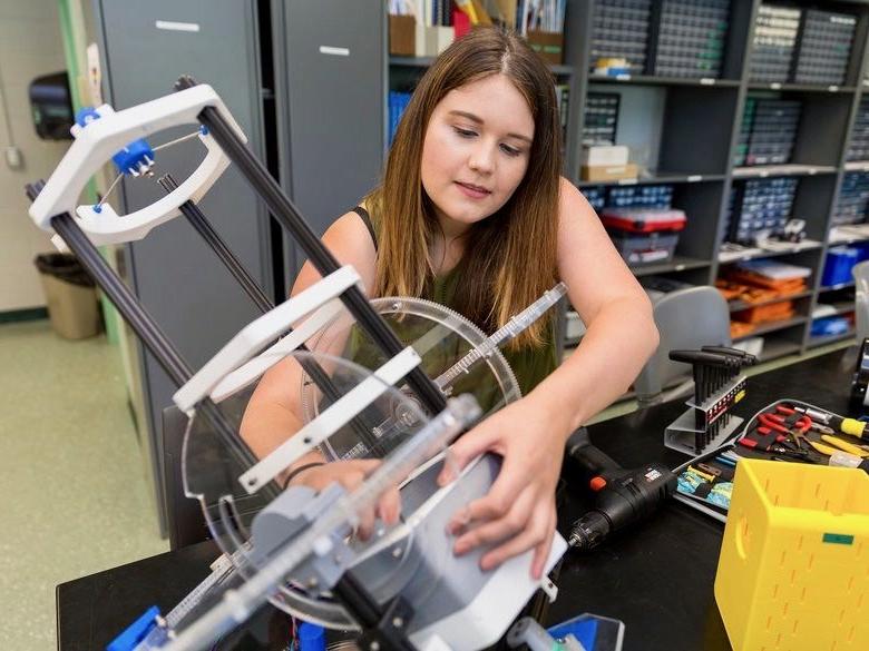 Female engineering student working in lab